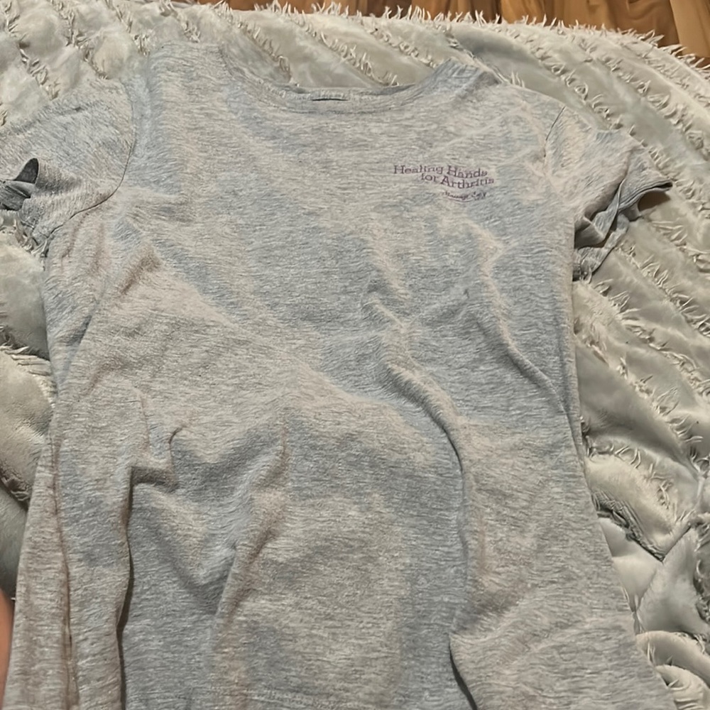 A tee shirt from massage envy spa supporting arthritis